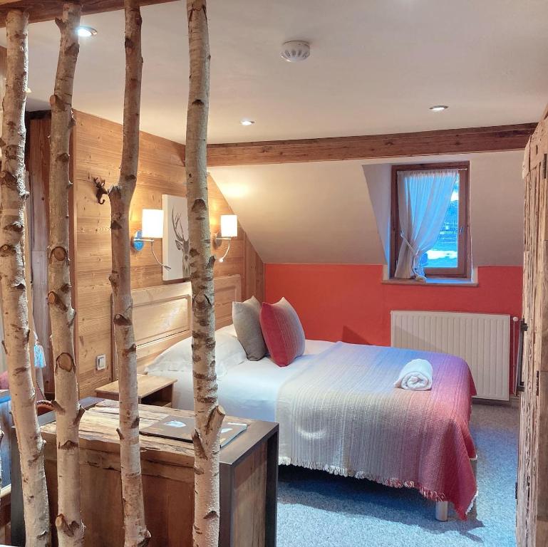Postel nebo postele na pokoji v ubytování Hôtel Les Cimes