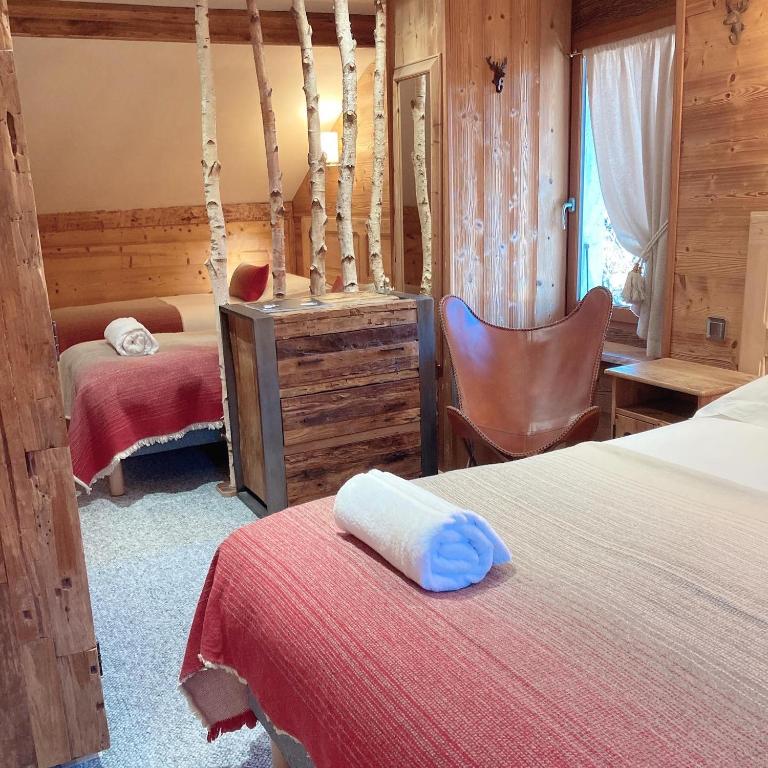 Postel nebo postele na pokoji v ubytování Hôtel Les Cimes