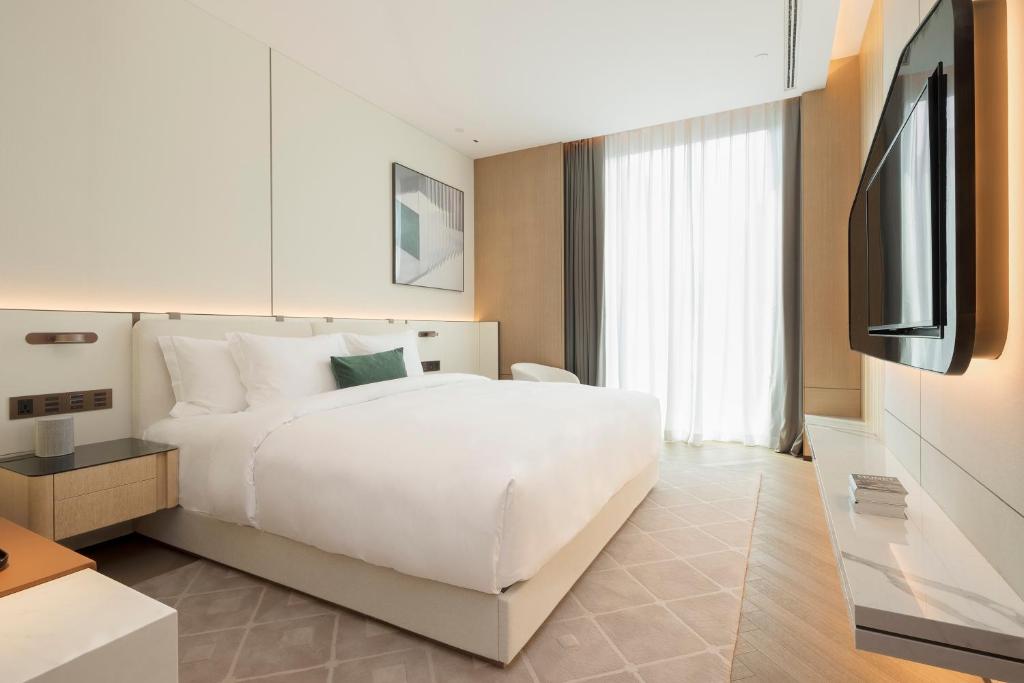 Postel nebo postele na pokoji v ubytování Shenzhen Ayearn Hotel