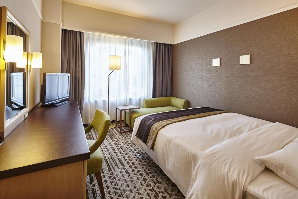 Postel nebo postele na pokoji v ubytování Hotel Nikko Tachikawa Tokyo