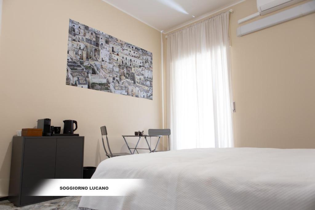 Postel nebo postele na pokoji v ubytování Soggiorno Lucano