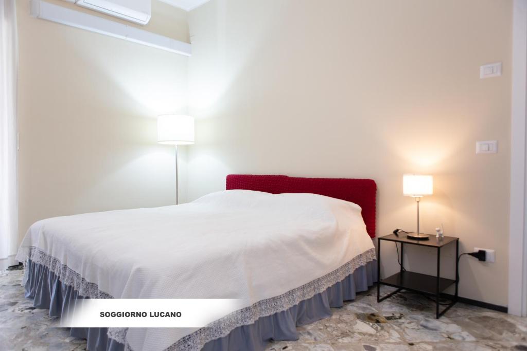Postel nebo postele na pokoji v ubytování Soggiorno Lucano