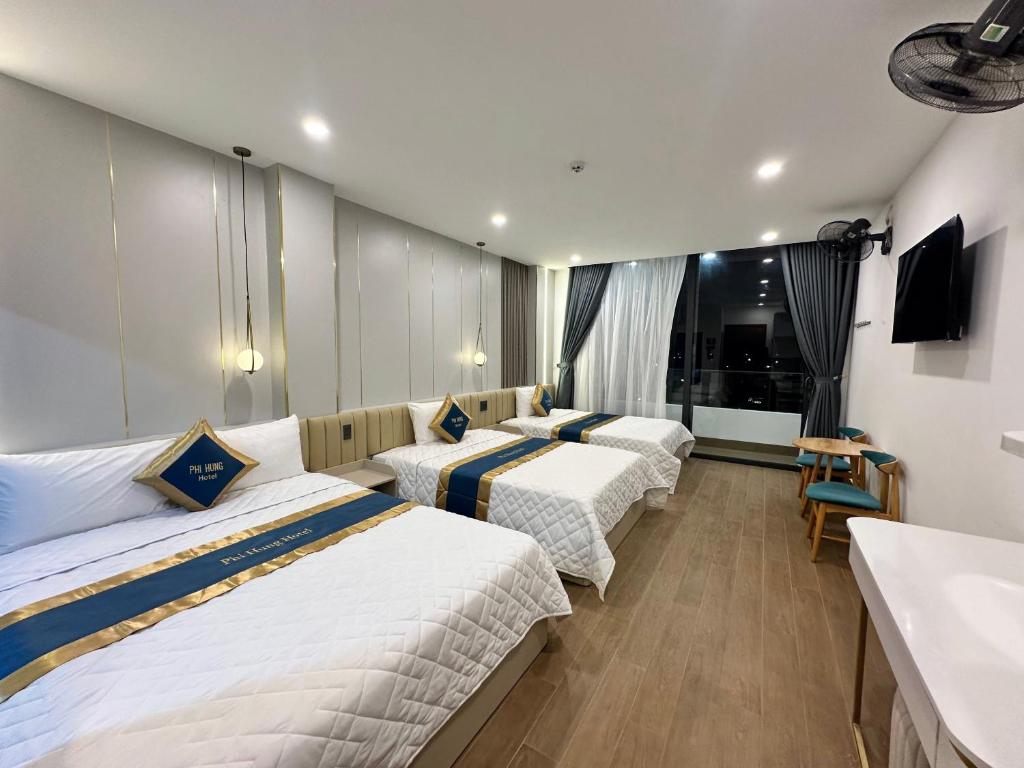 Postel nebo postele na pokoji v ubytování Hotel Phi Hùng