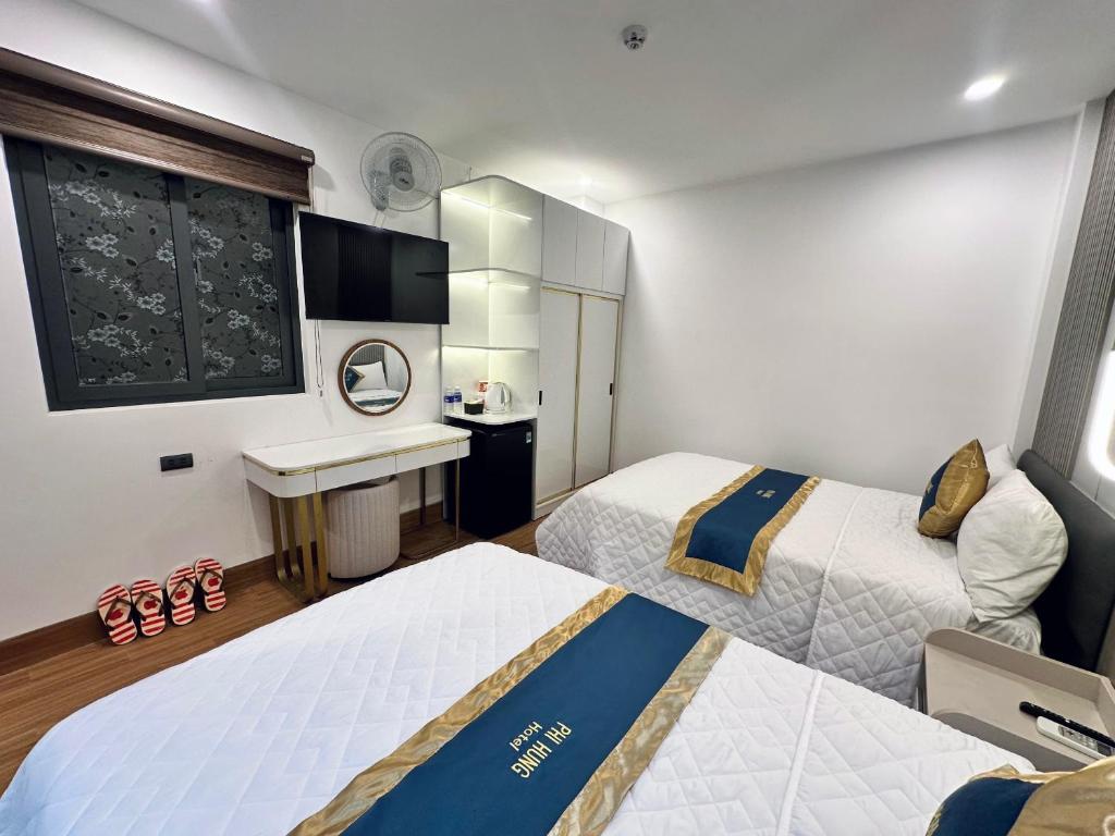 Postel nebo postele na pokoji v ubytování Hotel Phi Hùng