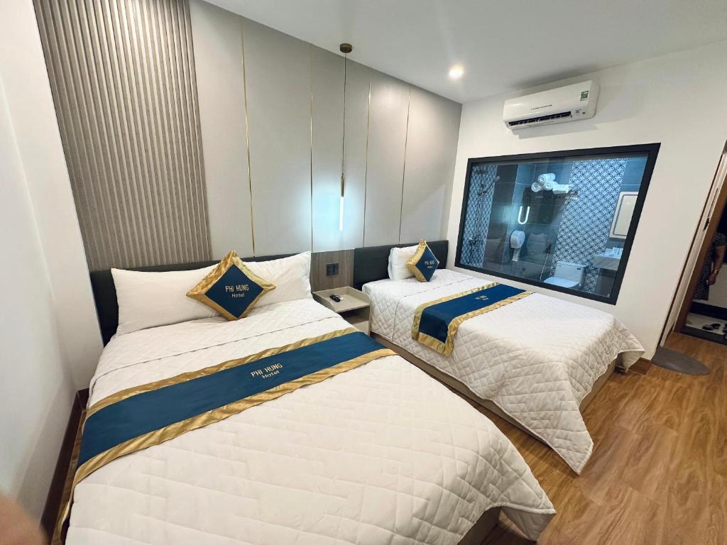 Postel nebo postele na pokoji v ubytování Hotel Phi Hùng