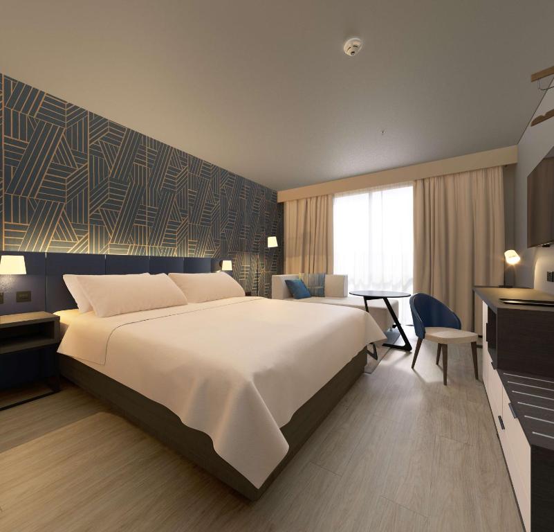 Postel nebo postele na pokoji v ubytování Hyatt Place Leeds