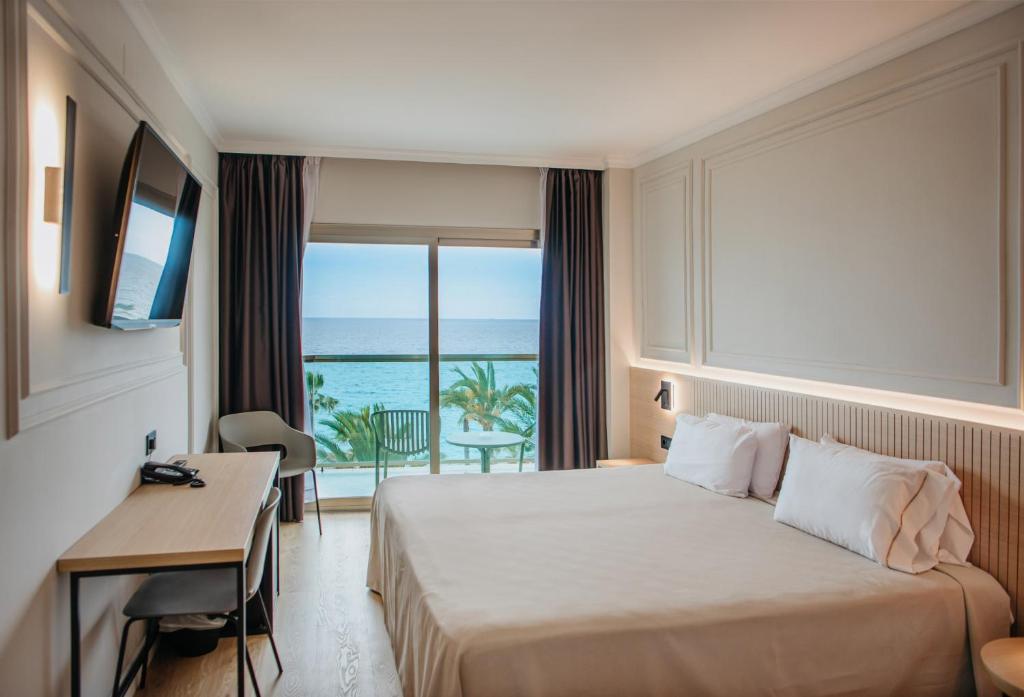 Postel nebo postele na pokoji v ubytování Hotel Miramar
