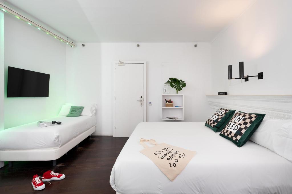 Posteľ alebo postele v izbe v ubytovaní Chic & Basic Born Boutique Hotel