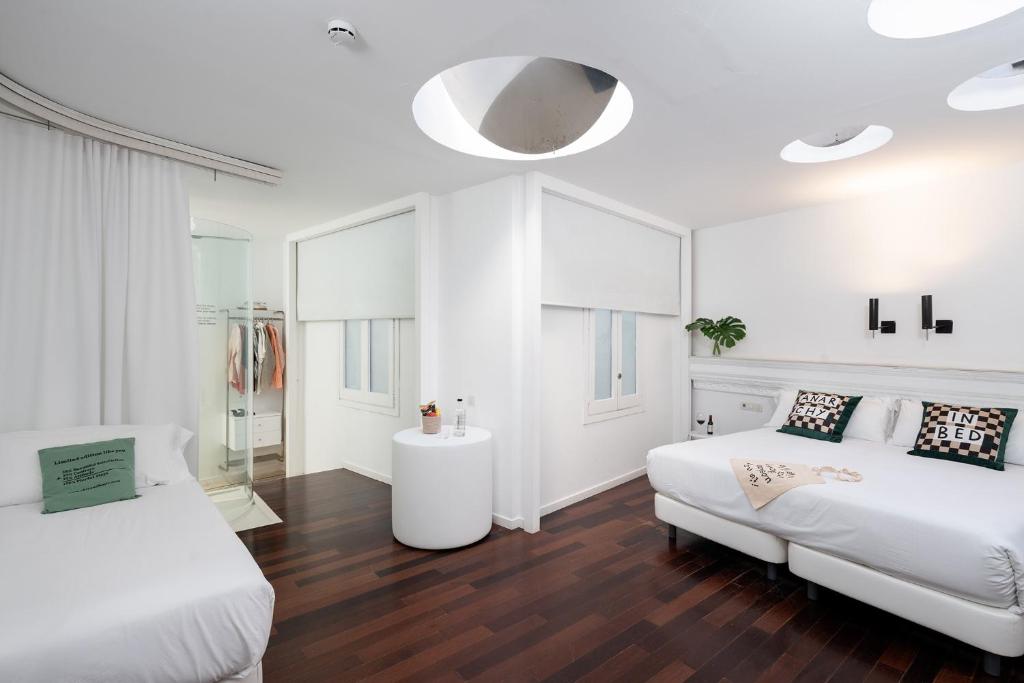 Posteľ alebo postele v izbe v ubytovaní Chic & Basic Born Boutique Hotel