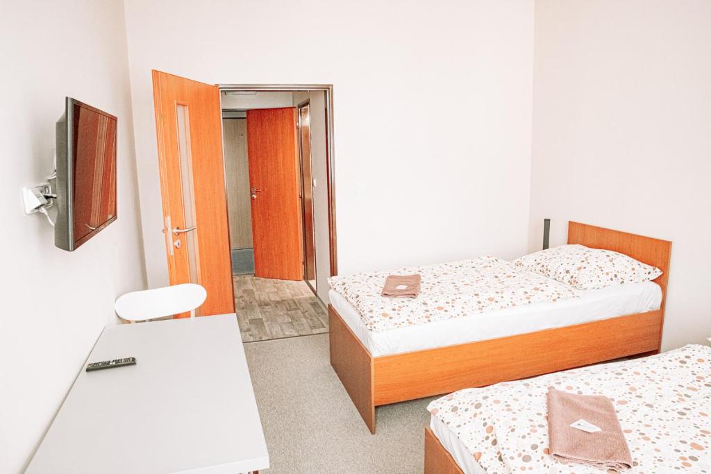 Postel nebo postele na pokoji v ubytování Penzion Centra Zdraví