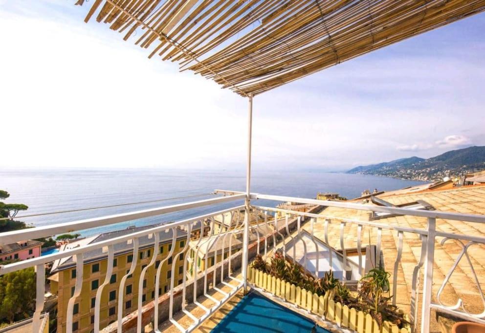 a view of the ocean from the balcony of a building at attico spettacolare vista mare in Camogli