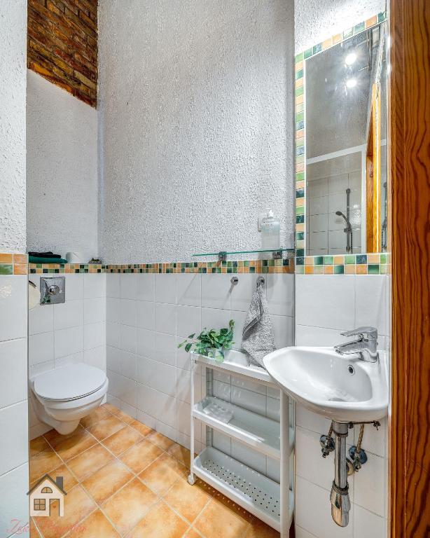Koupelna v ubytování ACME Apartments