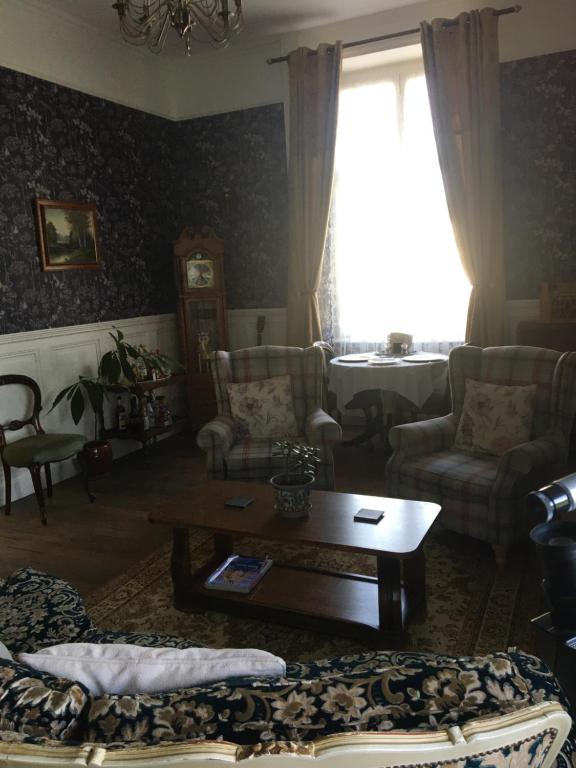 Posezení v ubytování Le Presbytère Chambre D'Hôtes