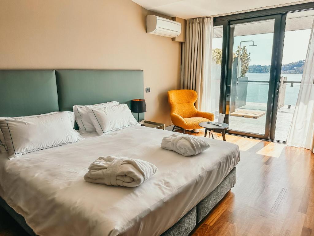Postel nebo postele na pokoji v ubytování Hotel Salò du Parc