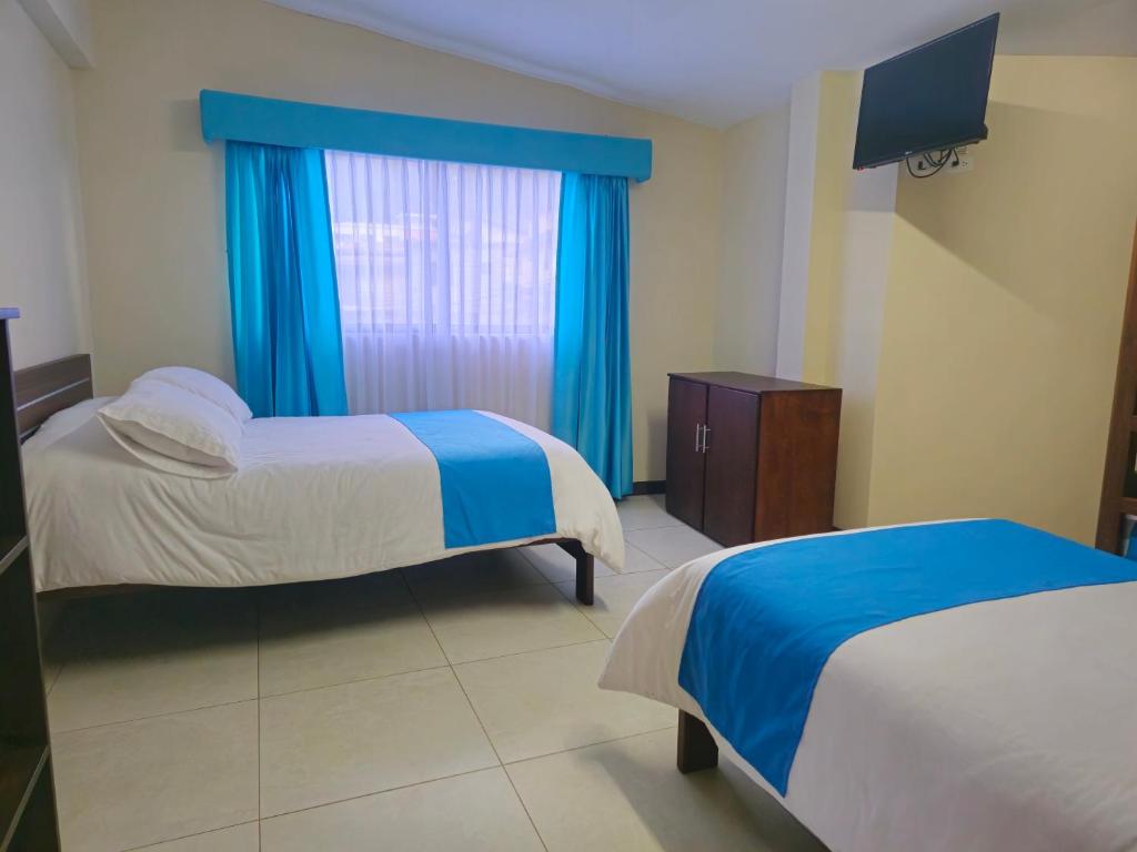 Postel nebo postele na pokoji v ubytování Hotel Tungurahua