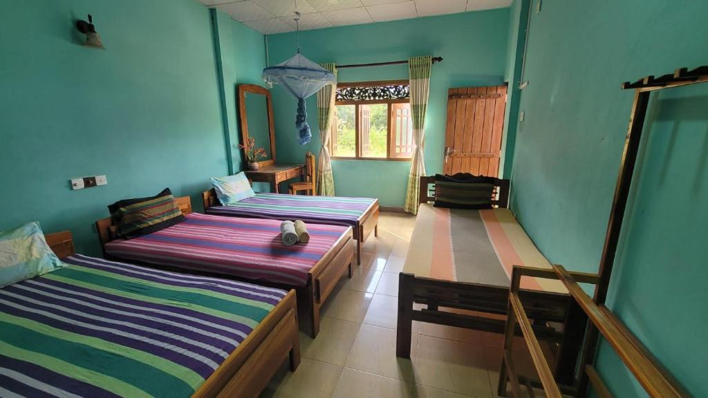 Postel nebo postele na pokoji v ubytování Thomasha Homestay Wellawaya