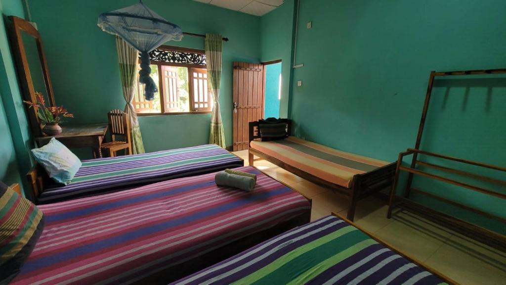 Postel nebo postele na pokoji v ubytování Thomasha Homestay Wellawaya