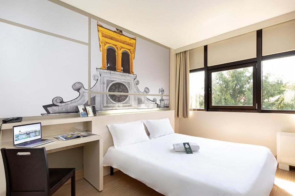 Postel nebo postele na pokoji v ubytování B&B Hotel Udine