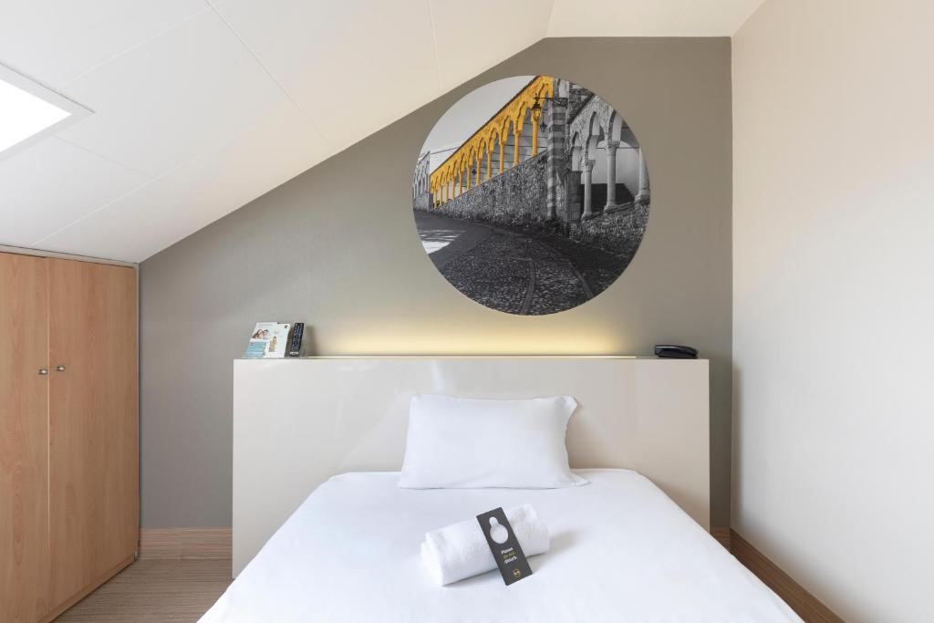 Postel nebo postele na pokoji v ubytování B&B Hotel Udine