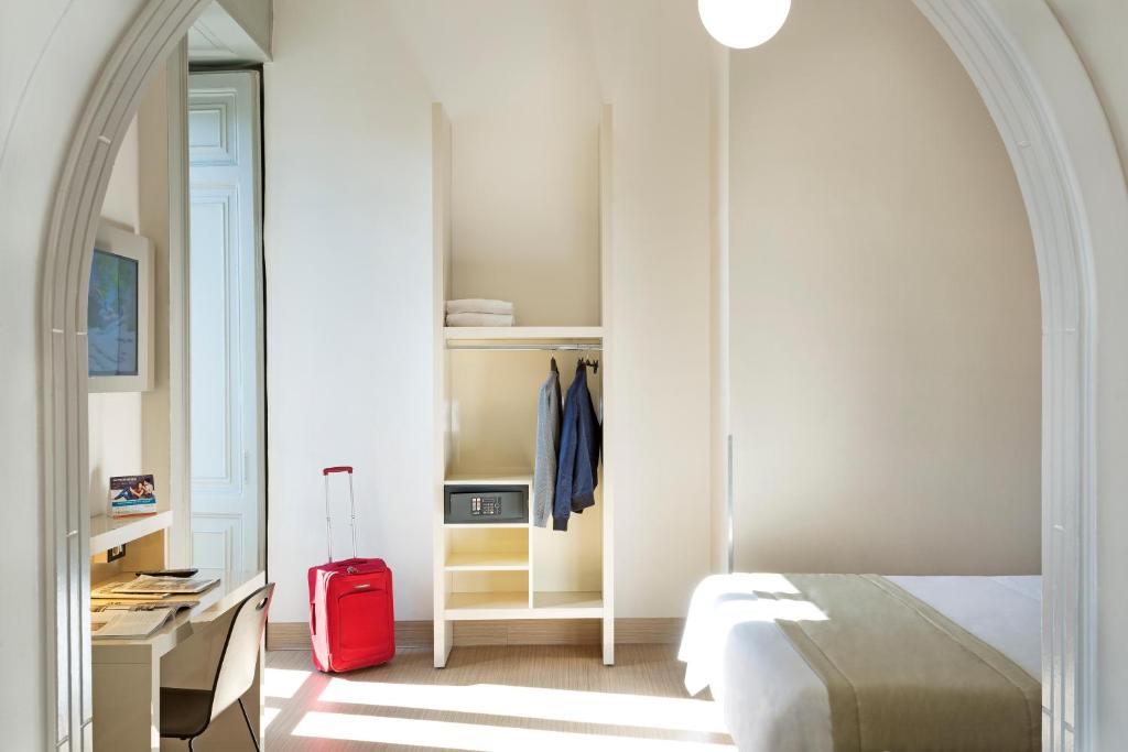Postel nebo postele na pokoji v ubytování B&B Hotel Napoli
