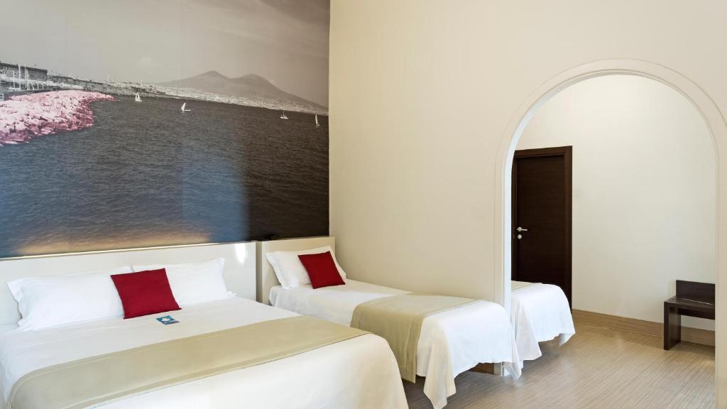 Postel nebo postele na pokoji v ubytování B&B Hotel Napoli