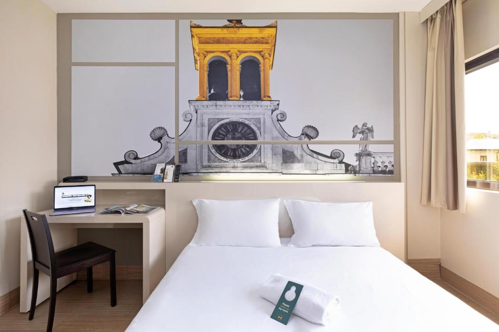 Postel nebo postele na pokoji v ubytování B&B Hotel Udine