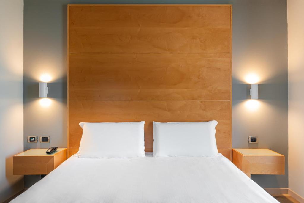 Postel nebo postele na pokoji v ubytování B&B HOTEL Pisa Airport