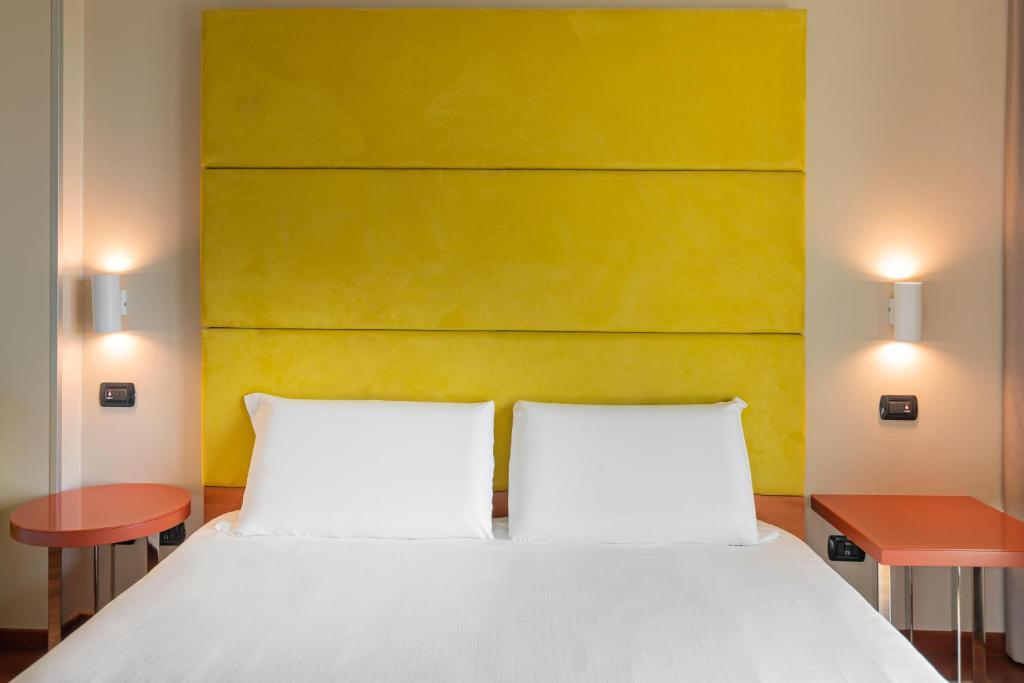 Postel nebo postele na pokoji v ubytování B&B HOTEL Pisa Airport