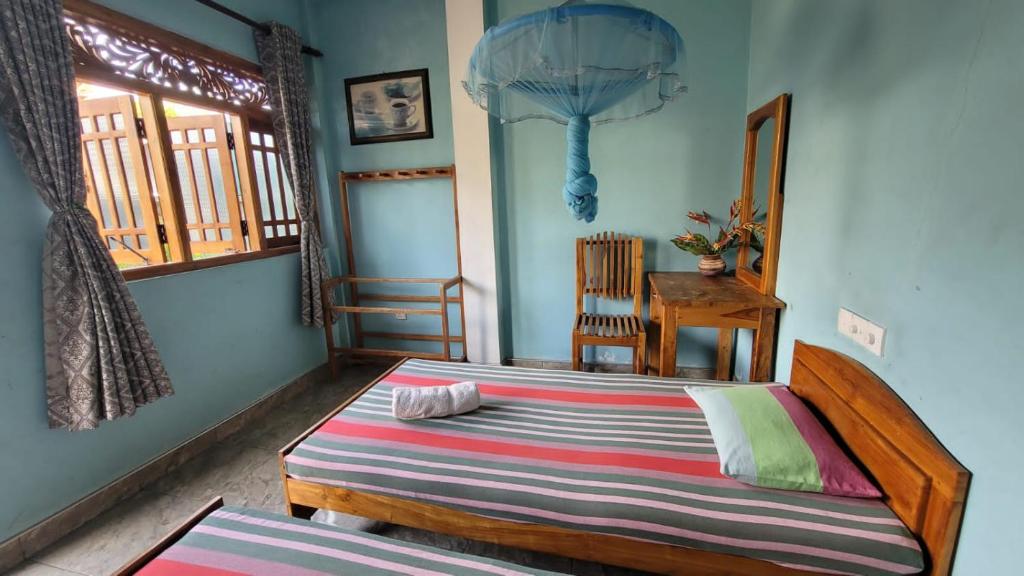Postel nebo postele na pokoji v ubytování Thomasha Homestay Wellawaya