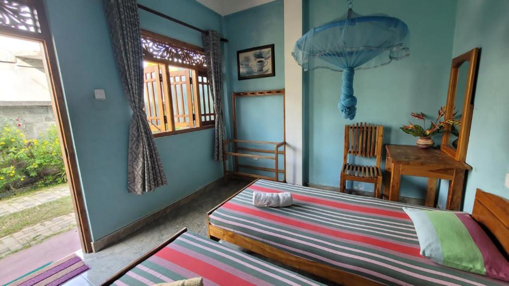 Postel nebo postele na pokoji v ubytování Thomasha Homestay Wellawaya