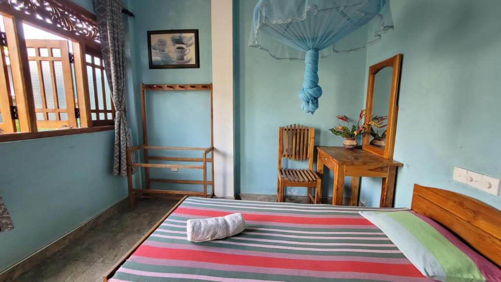 Postel nebo postele na pokoji v ubytování Thomasha Homestay Wellawaya