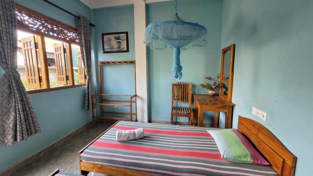 Postel nebo postele na pokoji v ubytování Thomasha Homestay Wellawaya