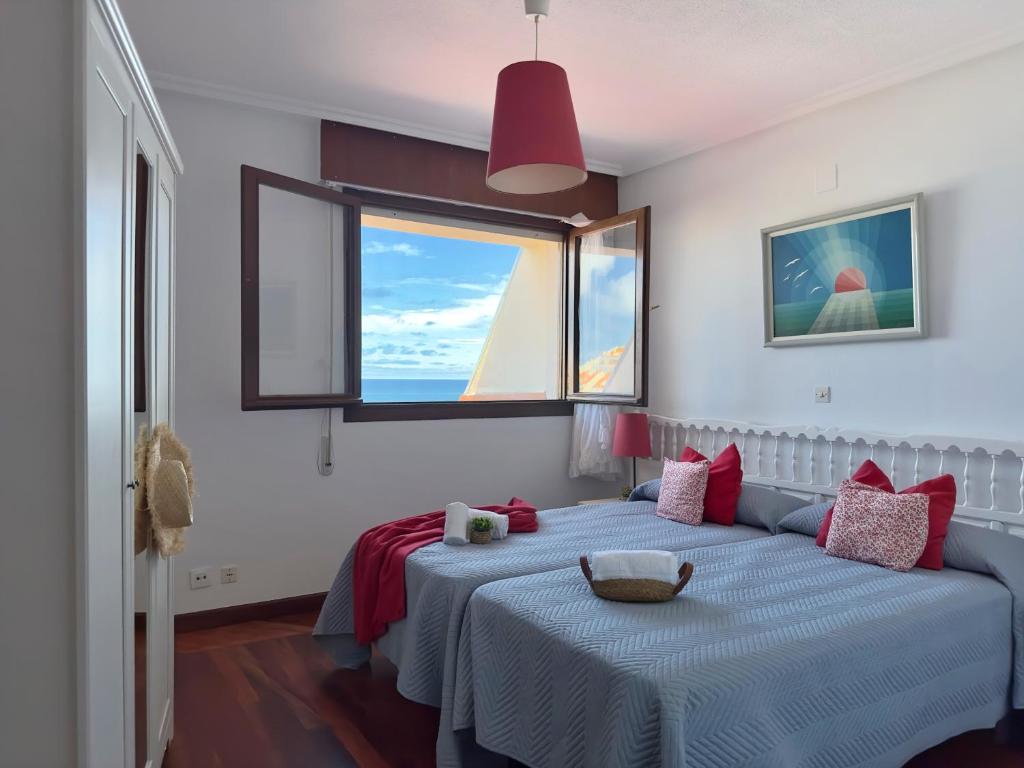 a bedroom with two beds and a window at Mar adentro - 5607 in Isla