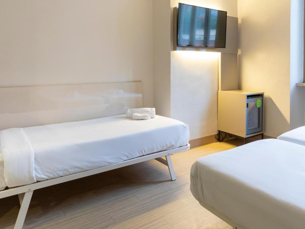 Postel nebo postele na pokoji v ubytování B&B Hotel Roma Trastevere