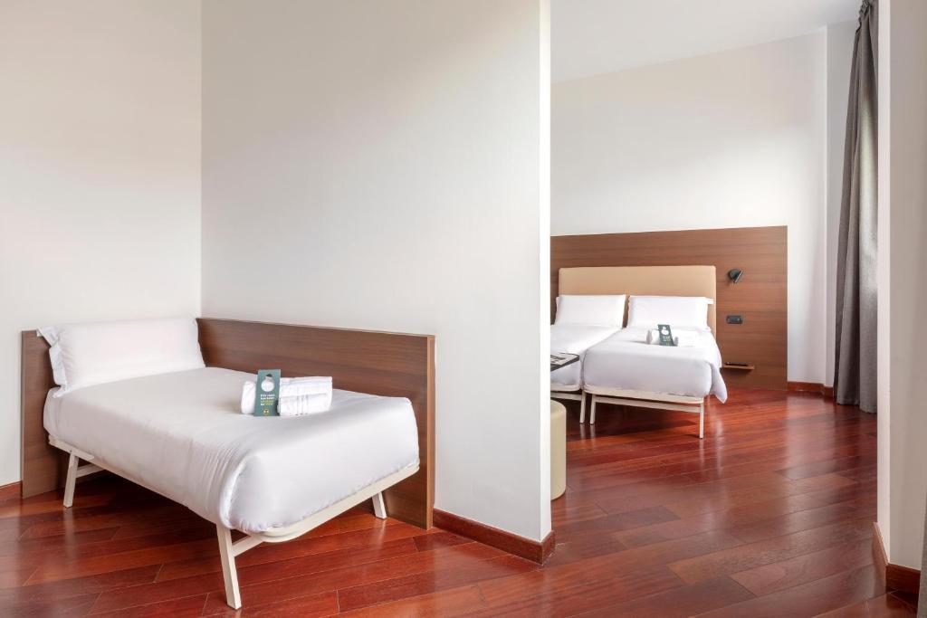 A bed or beds in a room at B&B Hotel Sassuolo