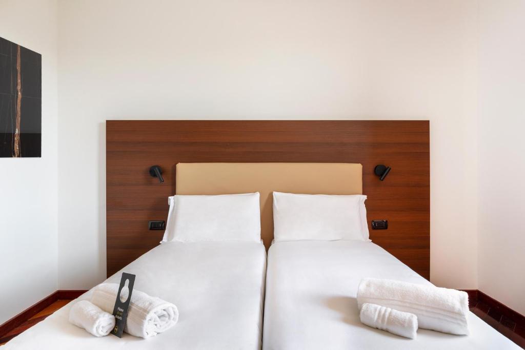 A bed or beds in a room at B&B Hotel Sassuolo