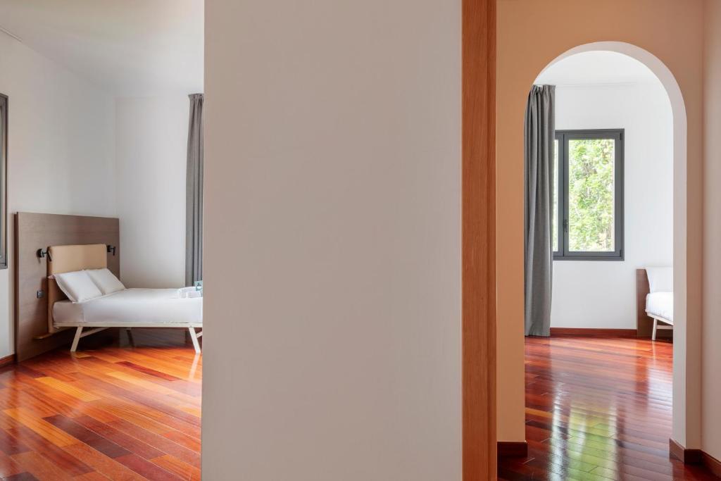 A bed or beds in a room at B&B Hotel Sassuolo