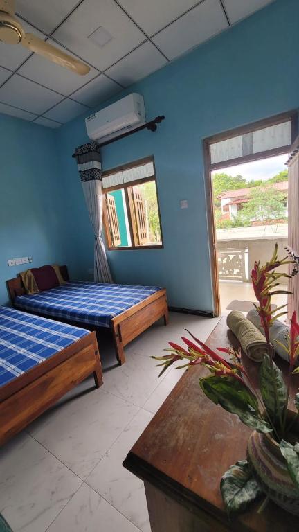Postel nebo postele na pokoji v ubytování Thomasha Homestay Wellawaya