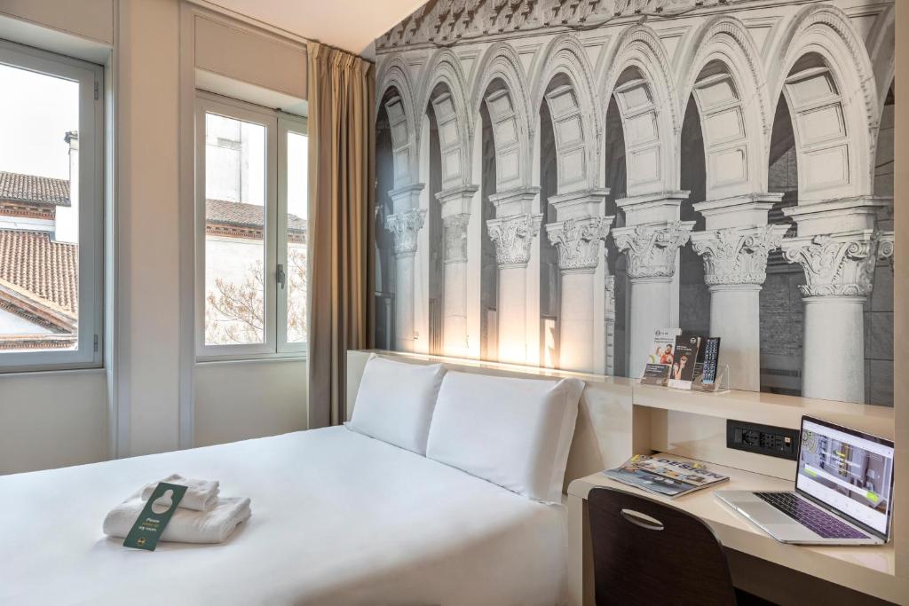 Postel nebo postele na pokoji v ubytování B&B Hotel Milano Sant'Ambrogio