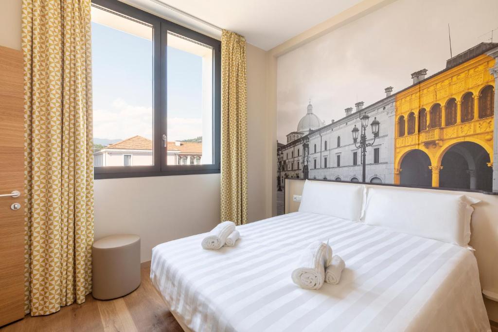 Postel nebo postele na pokoji v ubytování B&B Hotel Brescia