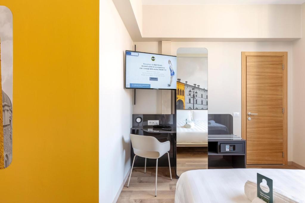 Postel nebo postele na pokoji v ubytování B&B Hotel Brescia