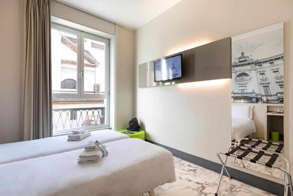 Postel nebo postele na pokoji v ubytování B&B Hotel Milano Sant'Ambrogio