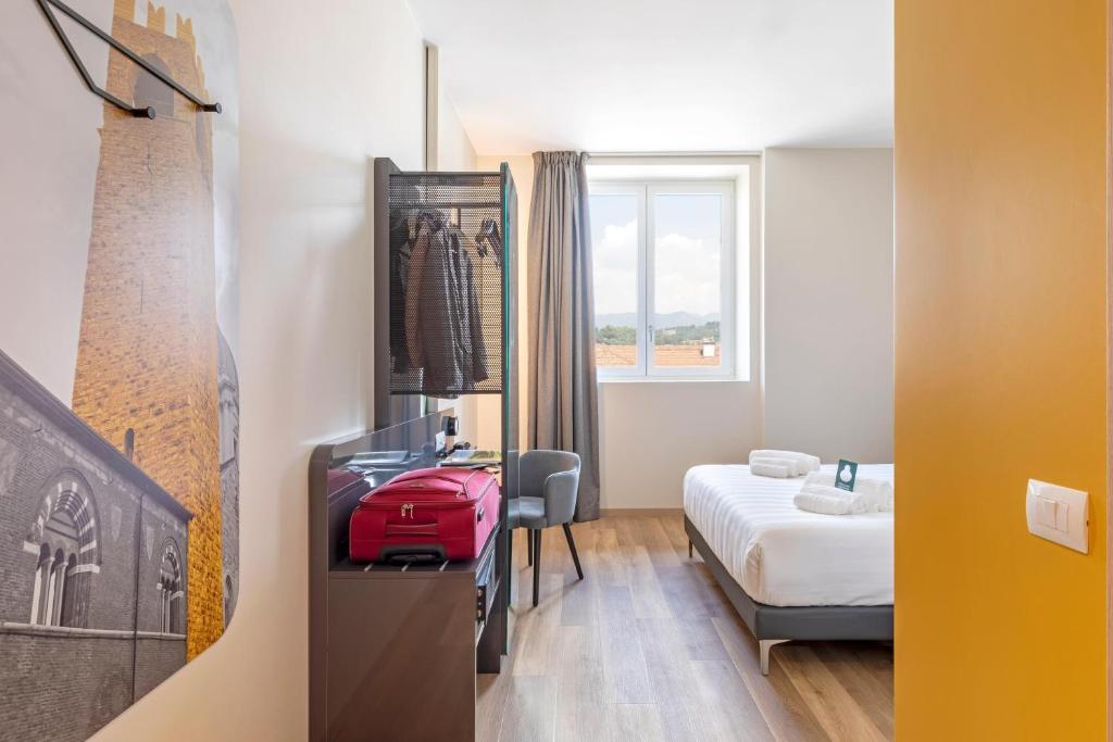 Postel nebo postele na pokoji v ubytování B&B Hotel Brescia