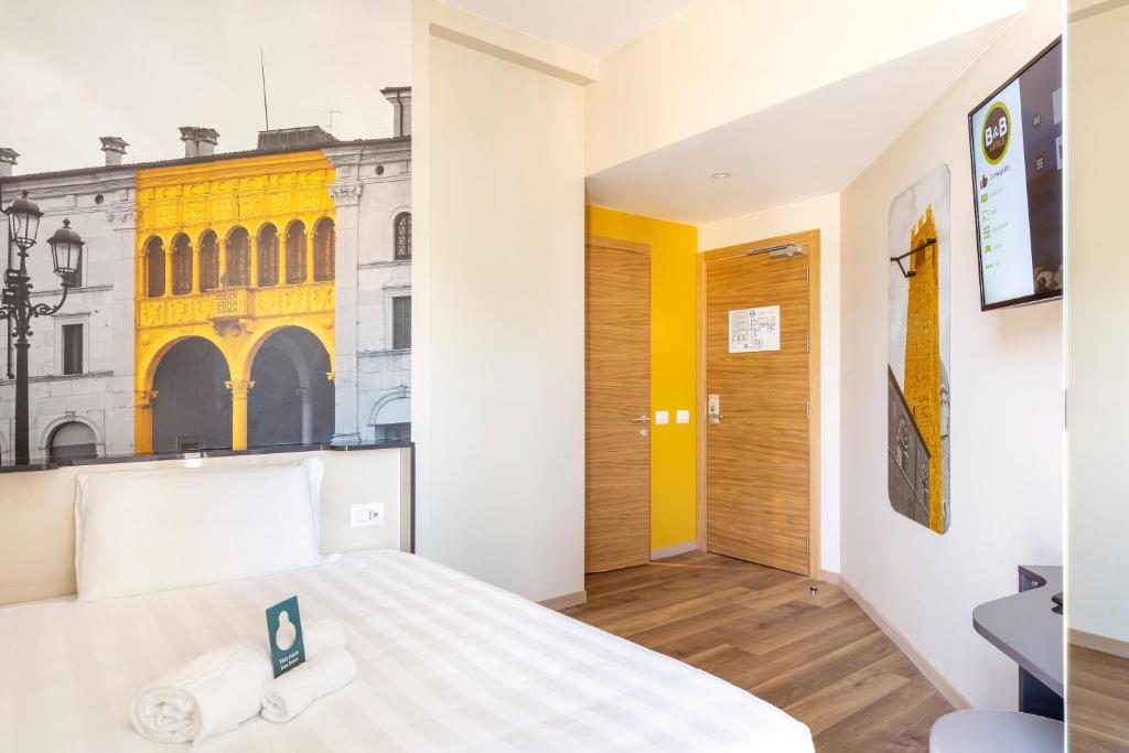 Postel nebo postele na pokoji v ubytování B&B Hotel Brescia