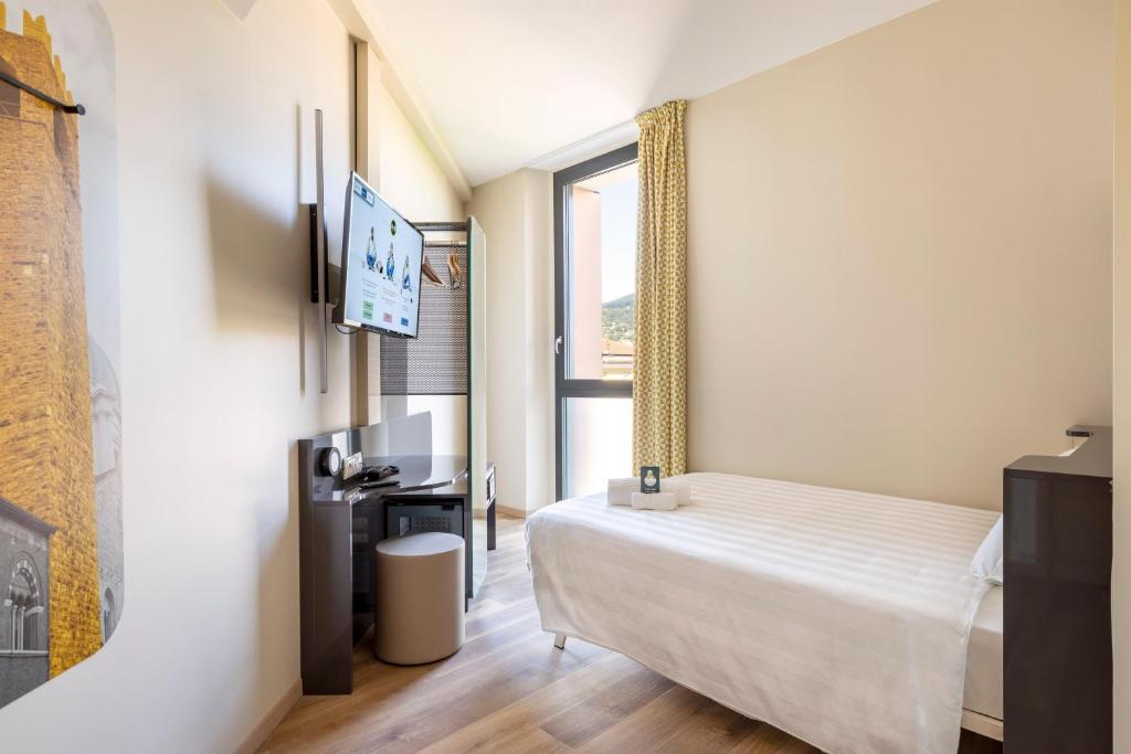 Postel nebo postele na pokoji v ubytování B&B Hotel Brescia