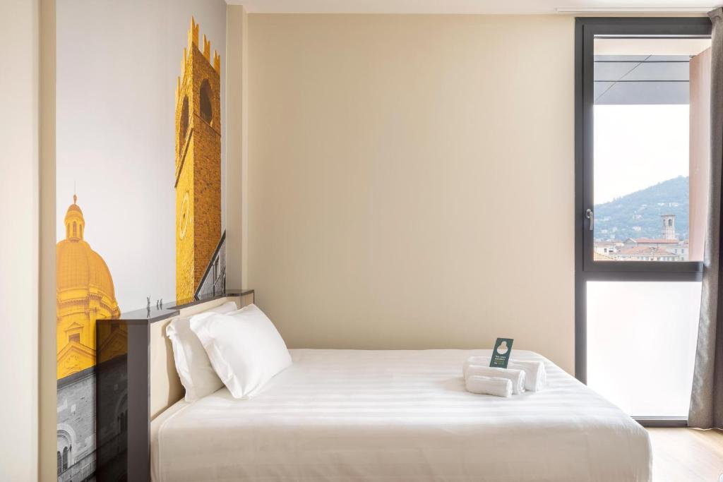Postel nebo postele na pokoji v ubytování B&B Hotel Brescia