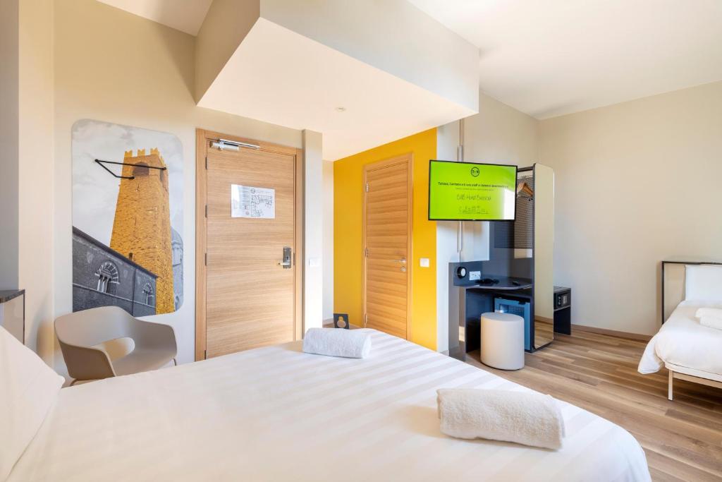 Postel nebo postele na pokoji v ubytování B&B Hotel Brescia