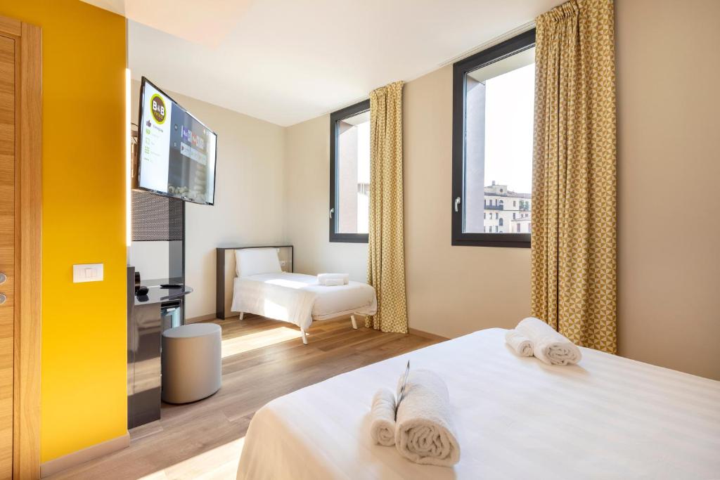 Postel nebo postele na pokoji v ubytování B&B Hotel Brescia