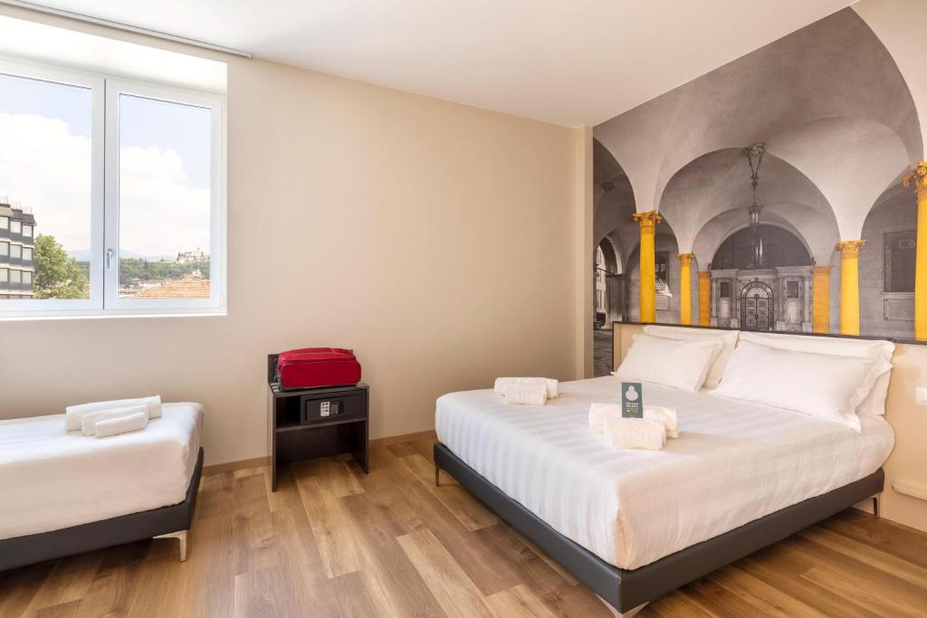 Postel nebo postele na pokoji v ubytování B&B Hotel Brescia