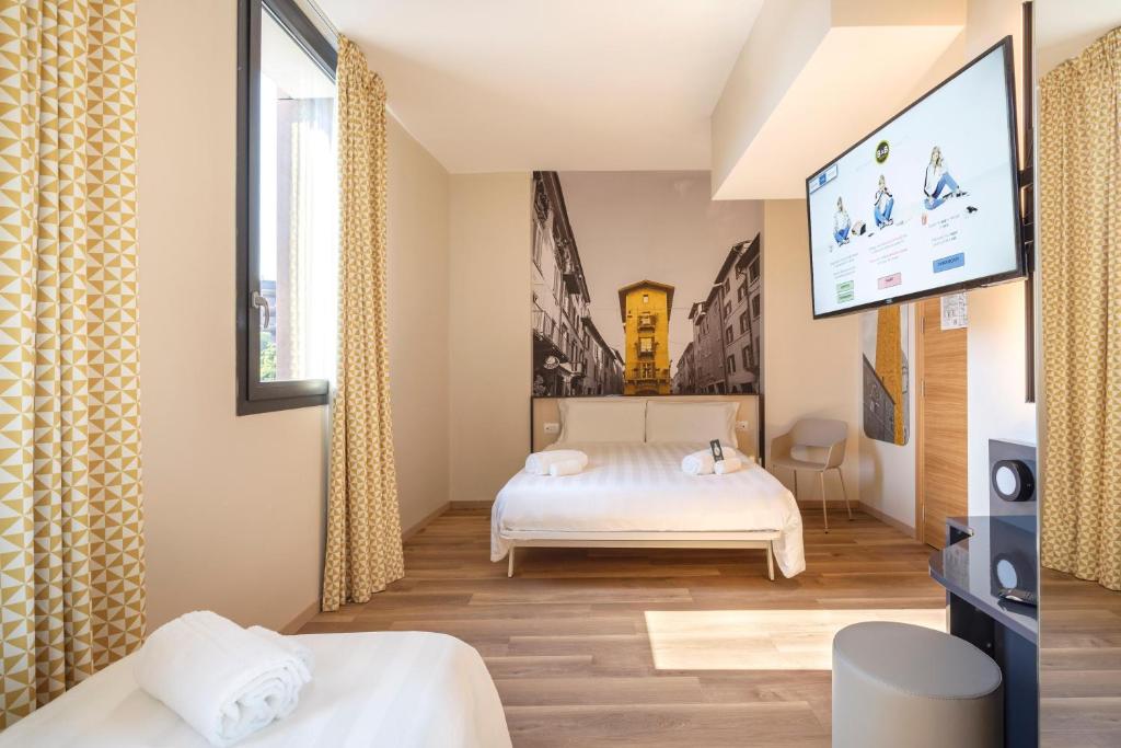 Postel nebo postele na pokoji v ubytování B&B Hotel Brescia